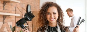 Women hairdresser holding hair dryer